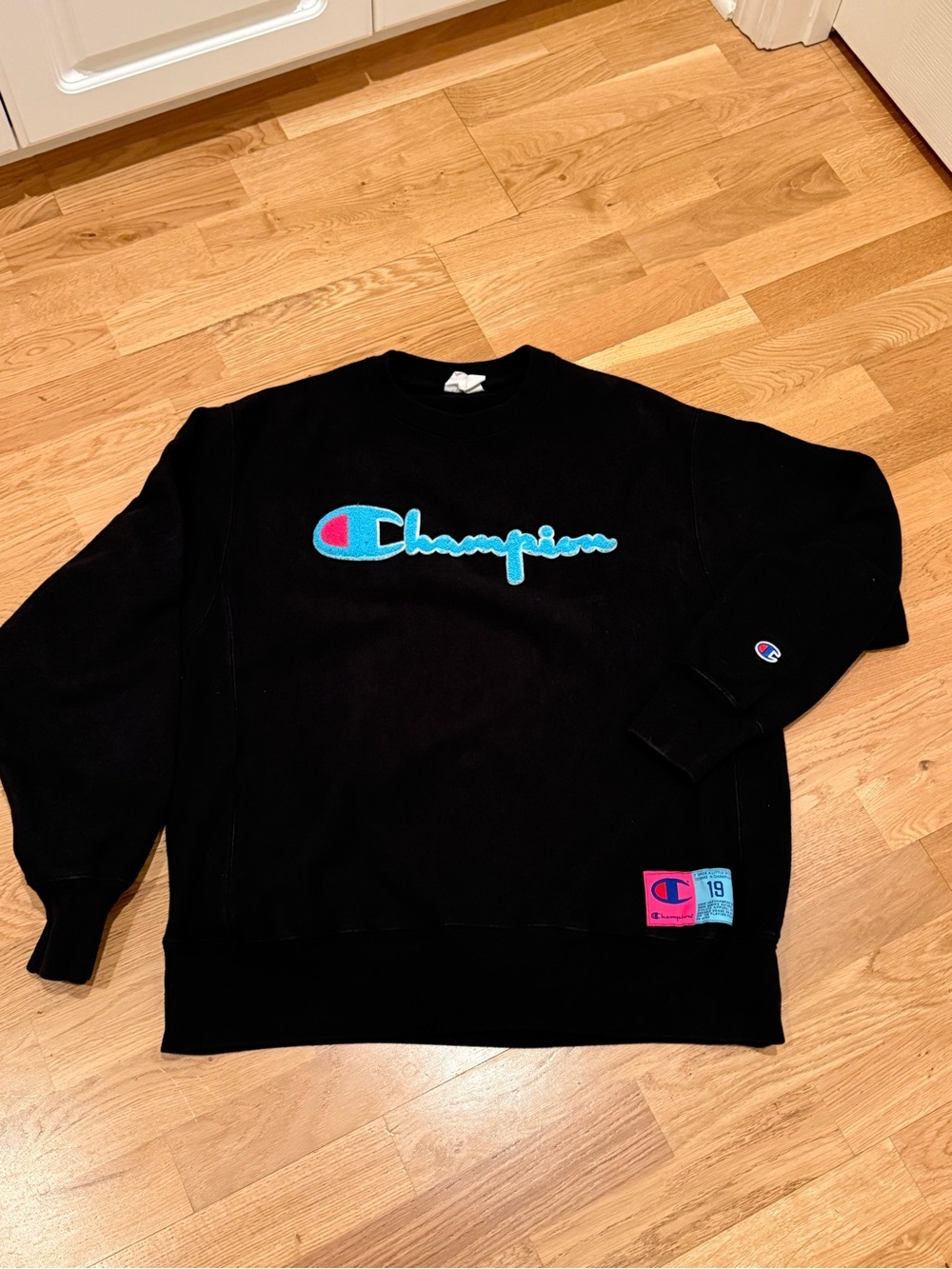 Champion Black Crewneck Sweatshirt with Blue and Pink Logo
